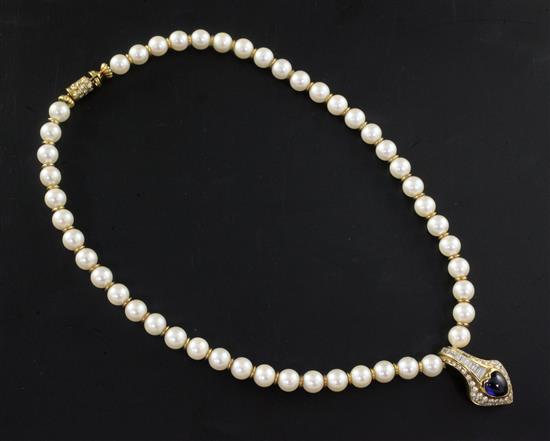 An 18ct gold, cultured pearl necklace with heart shaped cabochon sapphire and baguette and round cut diamond set pendant, 44cm.